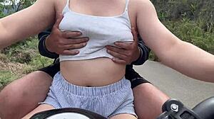 Client boldly puts hands in panties of busty brunette outdoors.