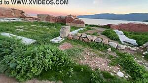 stroll hand in hand at sunset toward ancient outdoor ruins with petite friend