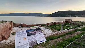 stroll hand in hand at sunset toward ancient outdoor ruins with petite friend