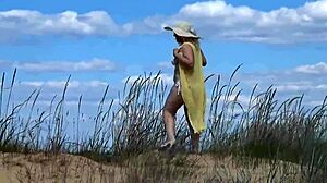 mommy shows off her curves on the beach