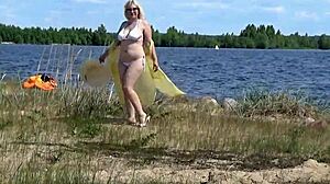 mommy shows off her curves on the beach