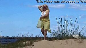 mommy shows off her curves on the beach