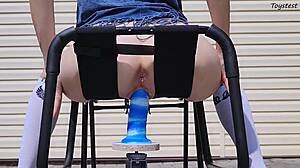 horny teen inserts big dildo from car jack in pussy